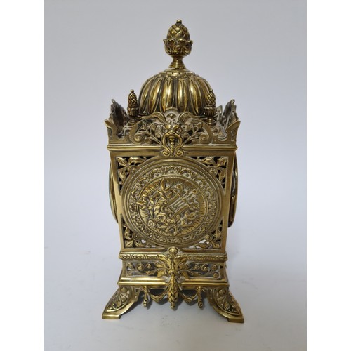 126 - A French pierced brass 30 day clock, striking on a bell, height 31cm.