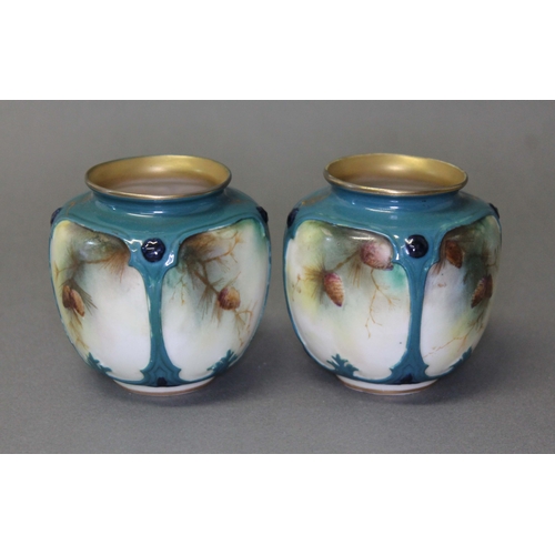 109 - A pair of Hadley's Worcester hand painted porcelain vase, decorated with birds and pine cones, heigh... 