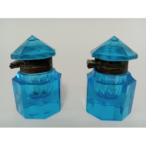 176 - A pair of blue glass inkwells.