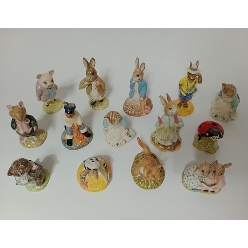 206 - A group of 14 Beatrix Potter, Royal Albert and Royal Doulton figurines.