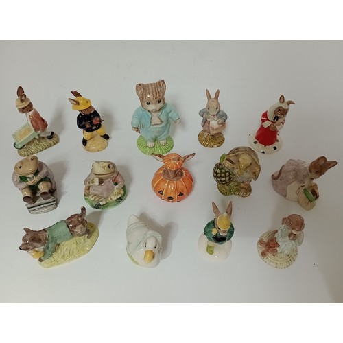 207 - A group of 14 Beatrix Potter, Royal Albert and Royal Doulton figurines.