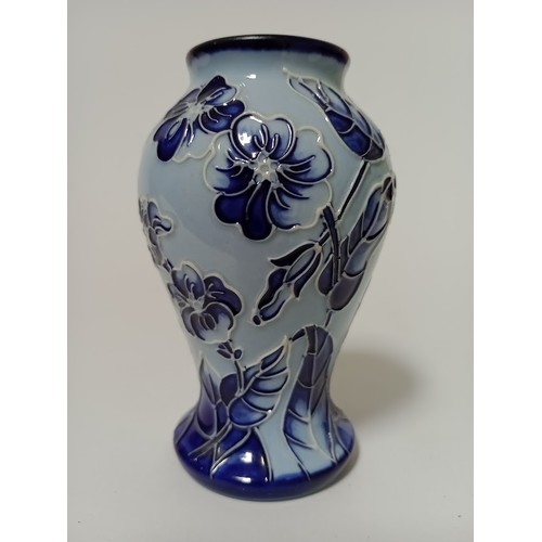 211 - A modern blue Moorcroft vase, decorated with flowers and leaves, impressed and painted marks, height... 