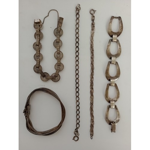 215 - Five silver bracelets, various hallmarks, gross weight 73 grams.