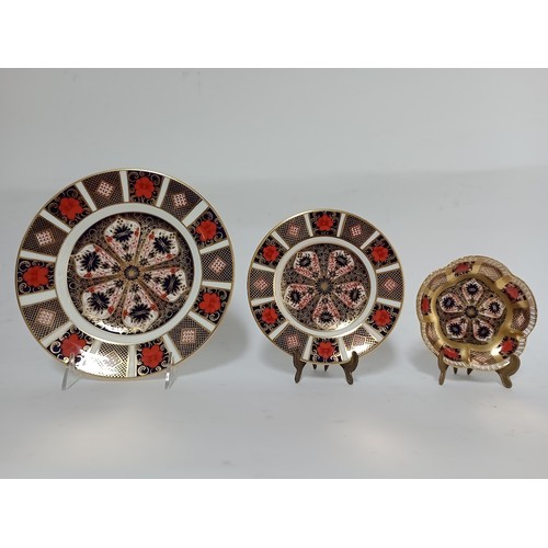 218 - Two Royal Crown Derby Imari pattern plates and a Royal Crown Derby Imari pattern dish.