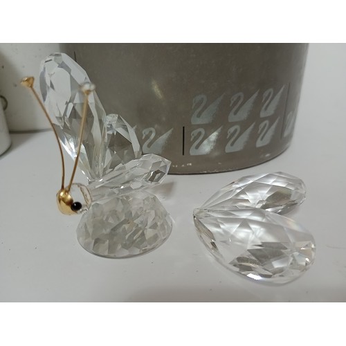 287 - Eight various Swarovski crystal ornaments to include rocking horse, bear, pram, cake, swan, etc. - w... 