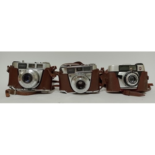 371 - Three vintage Kodak Pronto cameras and a hard camera case.