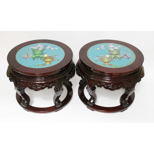 1 - A pair of Chinese cloisonne and carved hardwood jardiniere stands, of round formed inset with a cloi... 