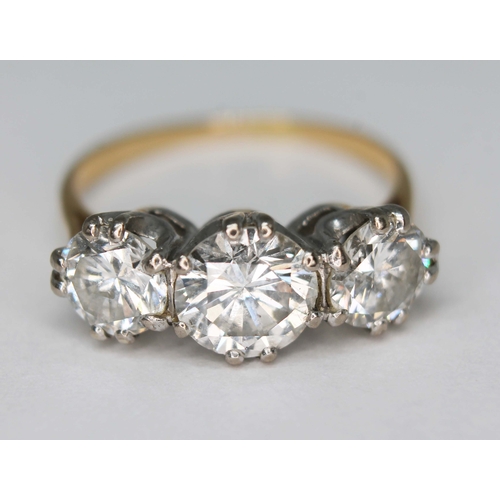 101 - A three stone diamond ring, the round brilliant cut diamonds weighing approx. 0.79, 1.36 & 0.76 cara... 