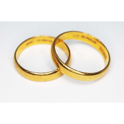 106 - Two hallmarked 22ct gold wedding bands, wt. 8.4g, size  P & S.