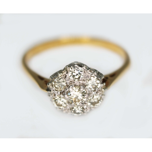 113 - A seven stone diamond cluster ring, total approx. diamond wt. 0.21 carats, colour K/L, clarity VS1/S... 