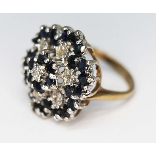 120 - A hallmarked 9ct gold diamond and sapphire cluster ring, the cluster measuring approx. 22mm, gross w... 