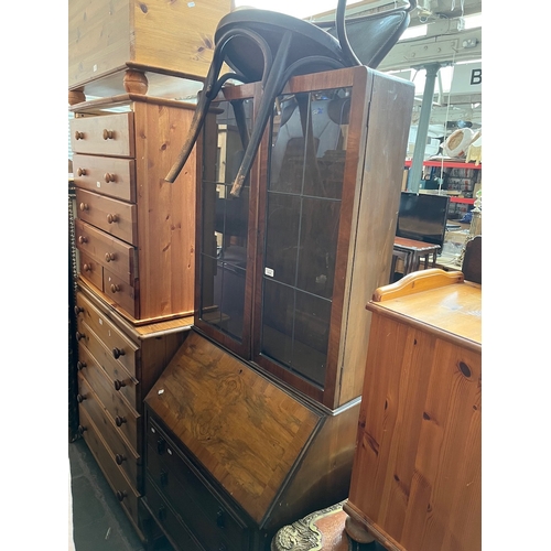 954 - A 1930s walnut bureau bookcase.