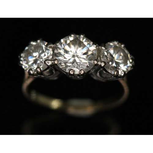 101 - A three stone diamond ring, the round brilliant cut diamonds weighing approx. 0.79, 1.36 & 0.76 cara... 