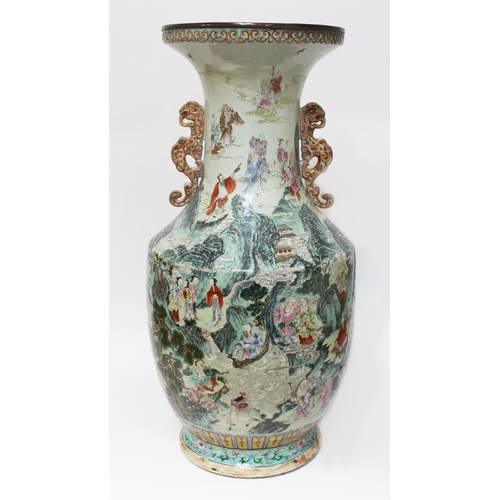 13 - A large Chinese immortals vase, Jiaqing period, twin handled with flared rim and ovoid body, decorat...