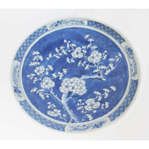 15 - A Chinese blue and white porcelain dish, 19th century, decorated with flowering prunus, unmarked, di... 