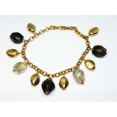 158 - A 9ct gold bracelet, with pebbles of rutilated quartz, smokey quartz, length 18.5cm, gross wt. 18.9g... 