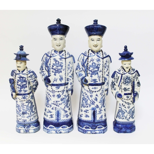 28 - A group of four Chinese blue and white porcelain figures, 20th century, seal marks to base, heights ... 