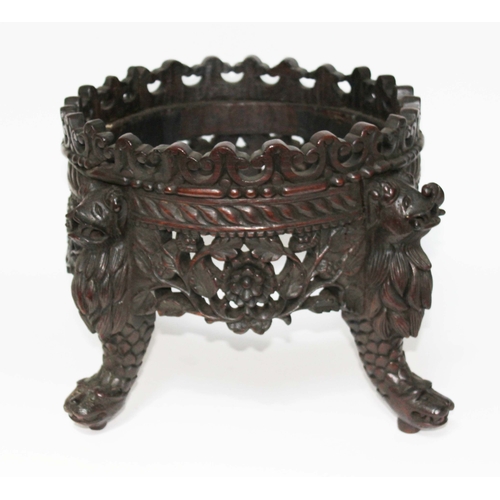35 - A Chinese carved hardwood stand, height 26cm.