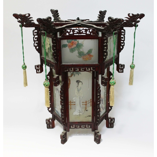 36 - A modern Chinese lantern of hexagonal form and set with glass panels, height 61cm.