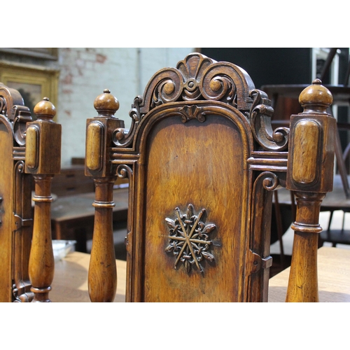 42 - A pair of mid 19th century oak hall chairs by Gillows Lancaster, height 105cm.
