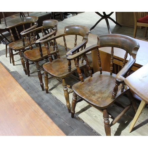 46 - A set of four beech captain's chairs.