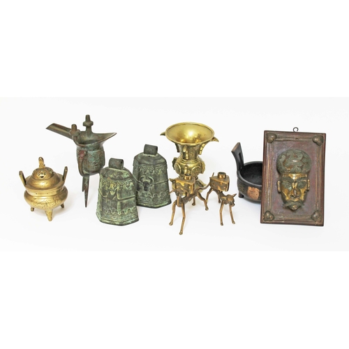 8 - Assorted eastern metalware including a Chinese gu vase, candlesticks, bells etc.
