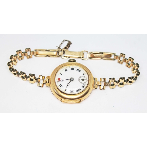 89 - An 18ct gold Tegra watch with rolled gold strap, gross wt. 21.5g.