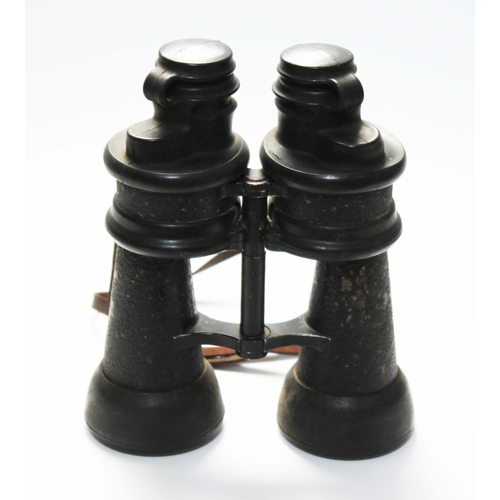 223 - A pair German WWII Kriegsmarine 7x50 binoculars, marked 'beh' and numbered 446923, with original rub... 