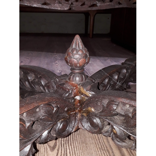 61 - A Chinese carved hardwood coffee table with onyx chess board top and resin pieces.