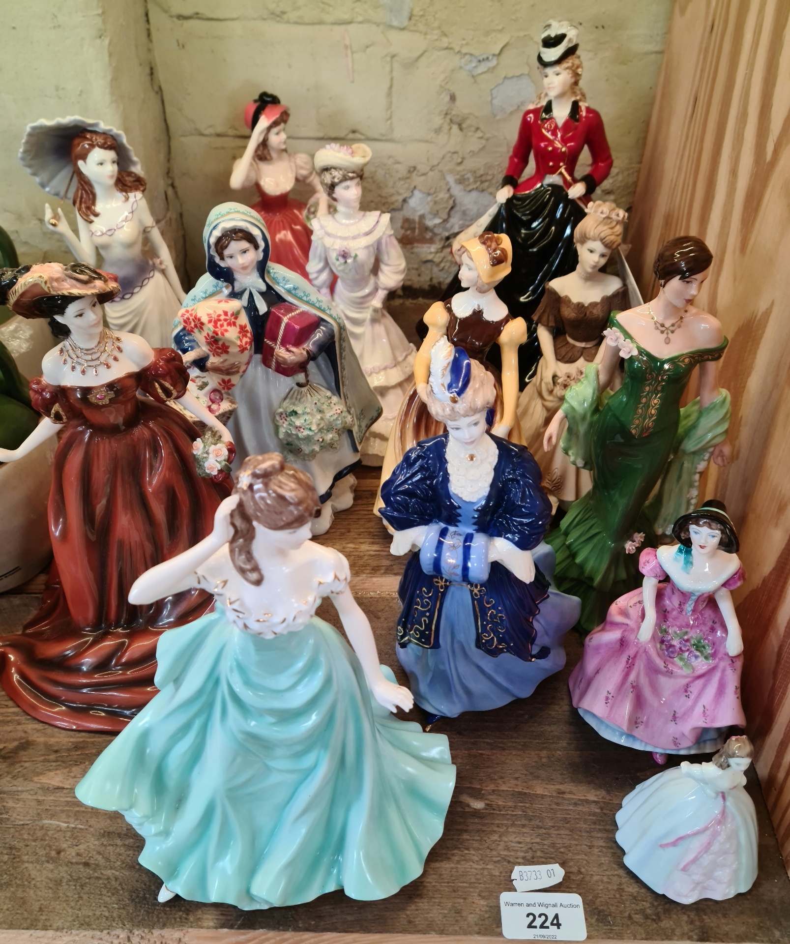 A collection of thirteen Coalport figures