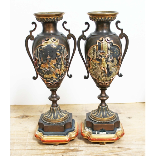 510 - A pair of mixed metal urns decorated with scenes from Shakesspeare, on polychrome bases, height 29.5... 