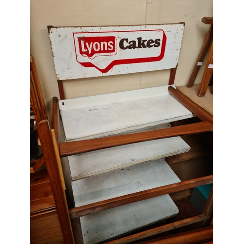 985 - A vintage Lyons Cakes enameled metal cake stand/shelving unit