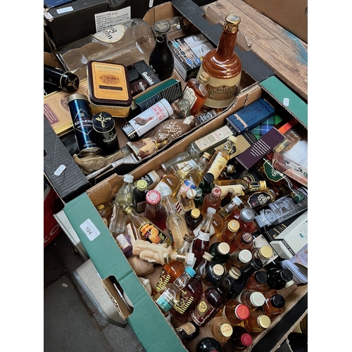 104 - Two boxes of mainly alcoholic miniatures. Over 70 bottles - some in original tins including Aardbeg,... 