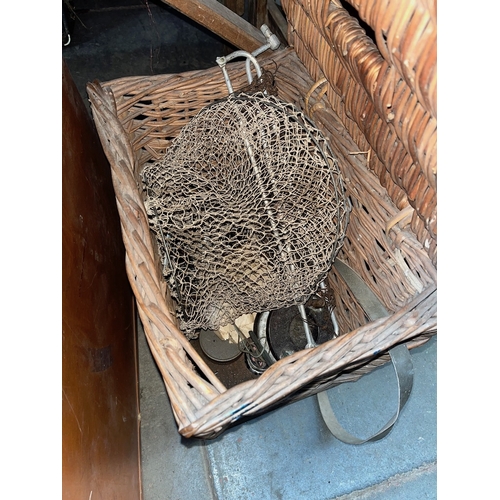 111 - A fishing basket containing landing net, keep net and a reel, together with a fishing rod