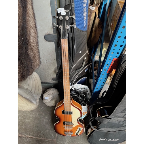 158 - A Westfield Hofner style bass guitar in Roksak guitar bag and bag of guitar straps etc