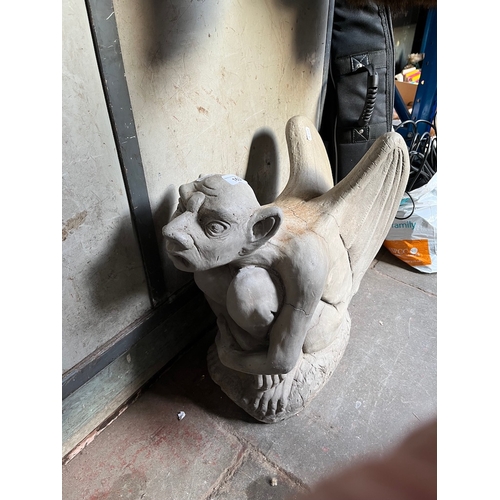 163 - A concrete gargoyle and a toad.