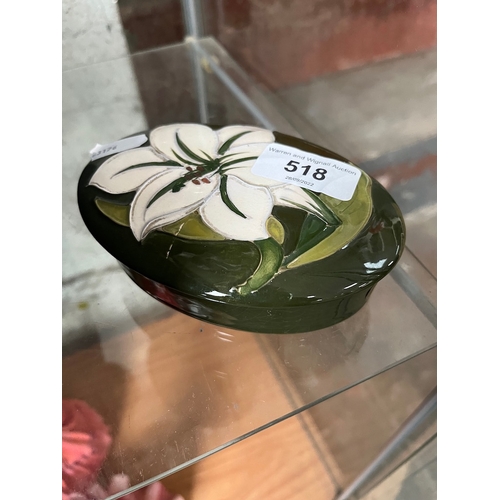 518 - A Moorcroft oval dish, with lid, green ground with lily pattern