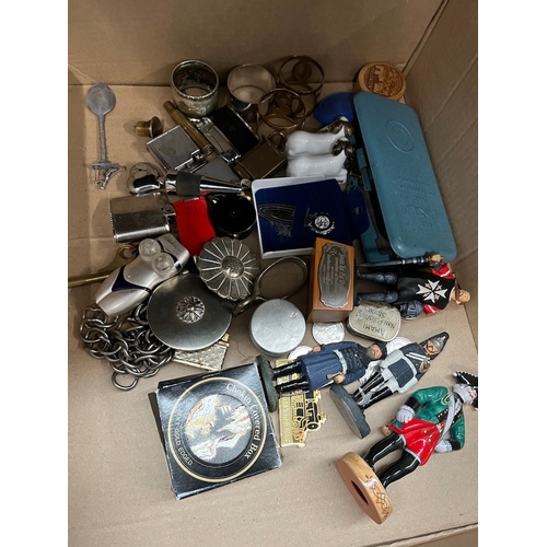 76 - A box of collectables including lighters, etc.