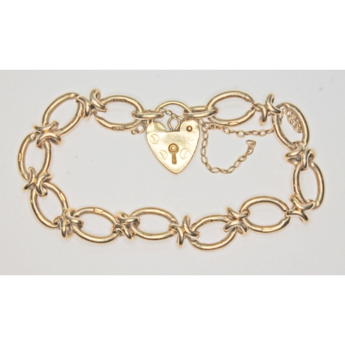 105 - A hallmarked 9ct gold fancy link bracelet with heart shaped pad lock clasp, wt. 17.9g, length 18cm.