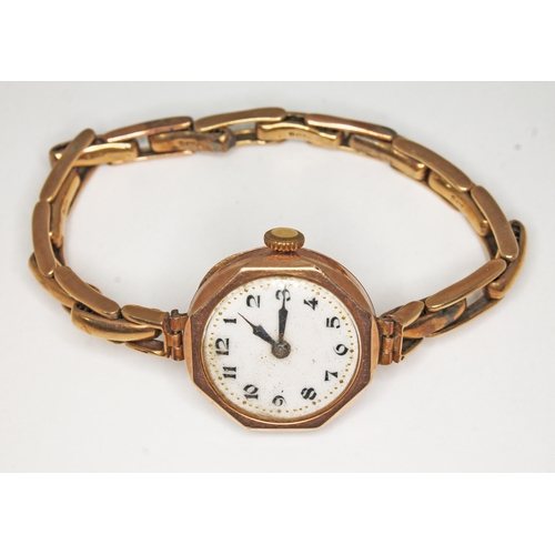 96 - A hallmarked 9ct gold ladies wristwatch with strap marked '9ct', gross wt. 18.3g.