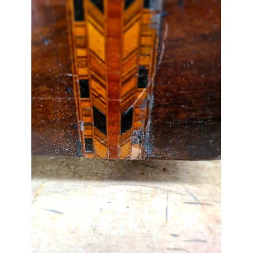 54 - A Victorian inlaid walnut sewing box containing a set of spoons and a shell cat.