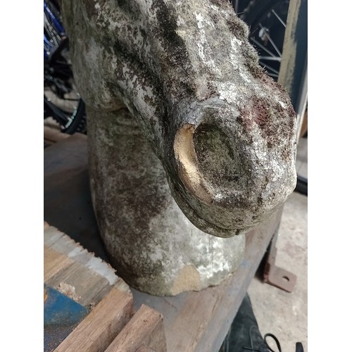 1037 - A horses head concrete garden ornament, height 53cm. 
Condition- signs of age including wear and som... 