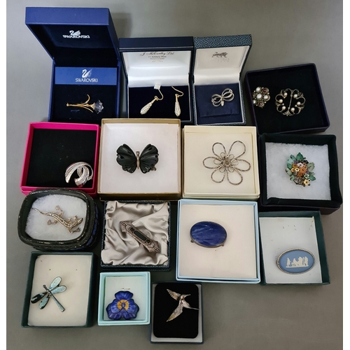 11 - A selection of various brooches, comprising mainly silver and to include, enameled, Scottish, Swarov... 