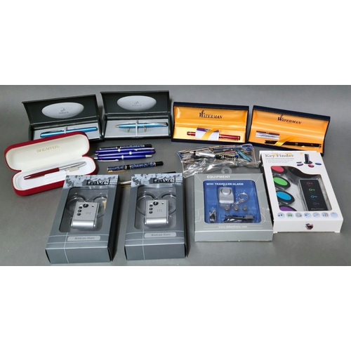 16 - A selection of mini traveller alarms, briefcase alarms together with collection of various pens to i... 