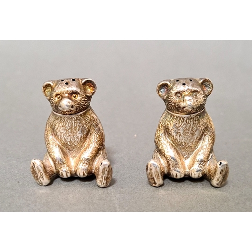 59 - Two Edwardian silver novelty pepper pots in the form of seated teddy bears with detachable heads, Bi... 