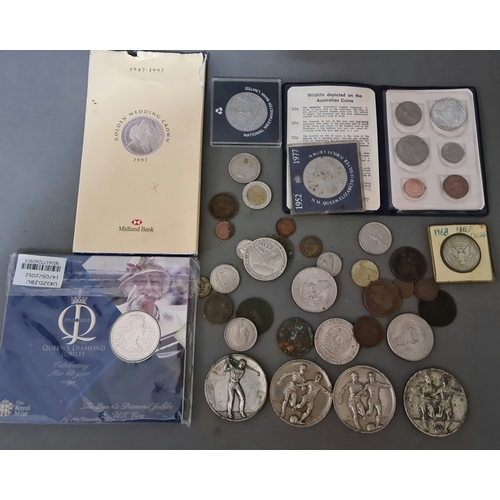 64 - A tin of world coins, tokens & medals.