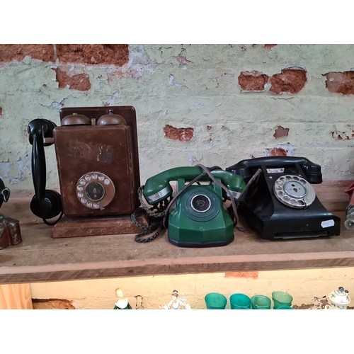 108 - 3 vintage telephones to include a black , a green and a wall mounted one.