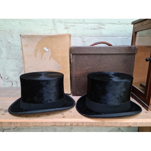 157 - Two vintage Dunn & Co silk top hats in original cases.