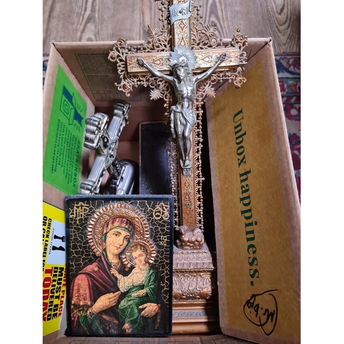 165 - A box of religious items including two crucifixes, a bible and a religious icon.