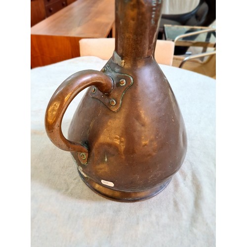 107 - A pair of copper jugs, stamped ER T47.